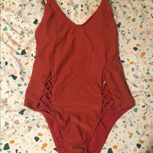 Strappy Rust colored one piece bathing suit
